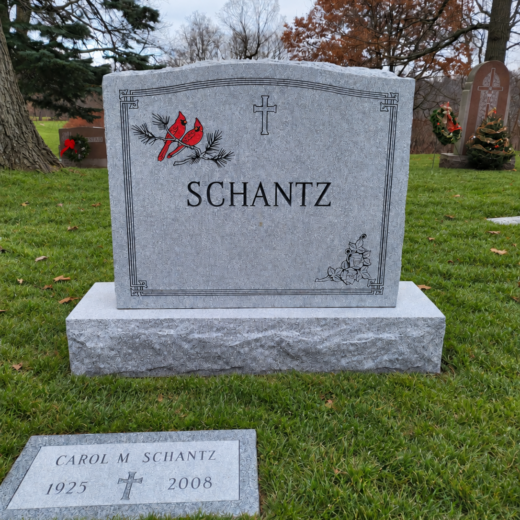 Gray Granite Headstone with Color-Etched Cardinal and Flat Marker Gray granite upright headstone with red cardinal etching and cross